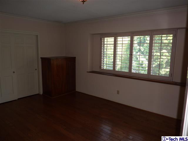 Undisclosed Address Pasadena, CA 91105 - Photo 27 of 50 a view of an empty room with wooden floor and a window