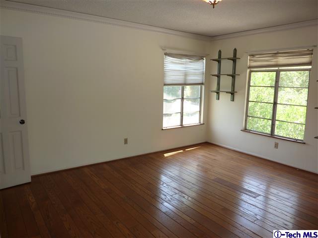 Undisclosed Address Pasadena, CA 91105 - Photo 33 of 50 an empty room with wooden floor and windows