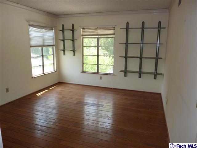 Undisclosed Address Pasadena, CA 91105 - Photo 34 of 50 an empty room with wooden floor and windows