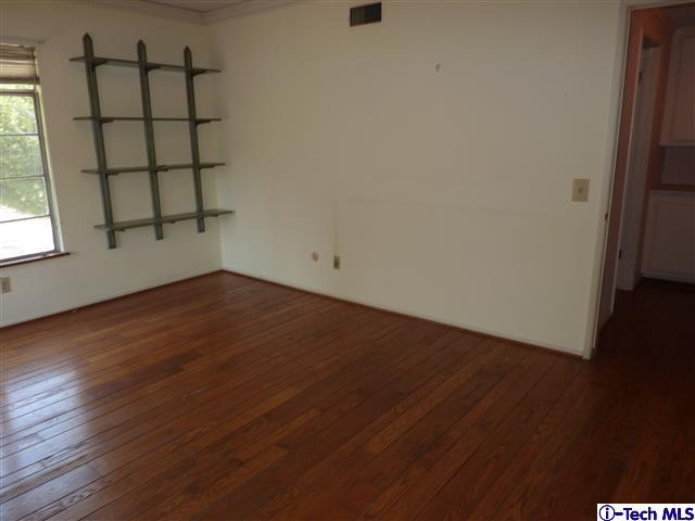 Undisclosed Address Pasadena, CA 91105 - Photo 35 of 50 an empty room with wooden floor and windows