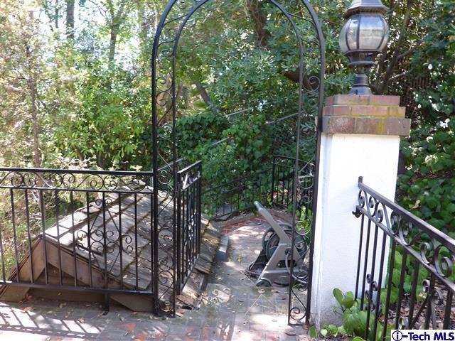 Undisclosed Address Pasadena, CA 91105 - Photo 42 of 50 a front view of a house with a garden