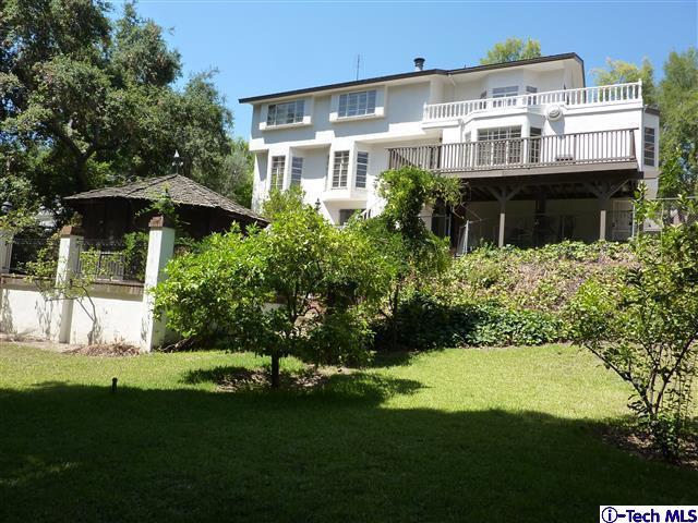 Undisclosed Address Pasadena, CA 91105 - Photo 7 of 50 a view of a house with a yard and potted plants