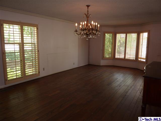 Undisclosed Address Pasadena, CA 91105 - Photo 9 of 50 a view of an empty room with wooden floor and a window