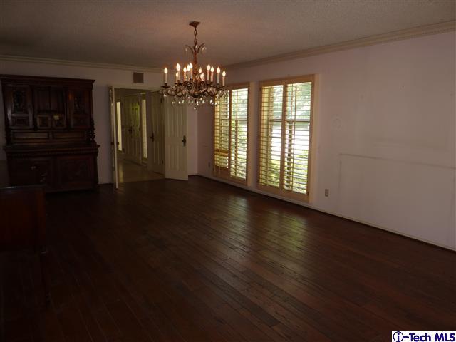 Undisclosed Address Pasadena, CA 91105 - Photo 10 of 50 a view of a room with wooden floor chandelier and windows
