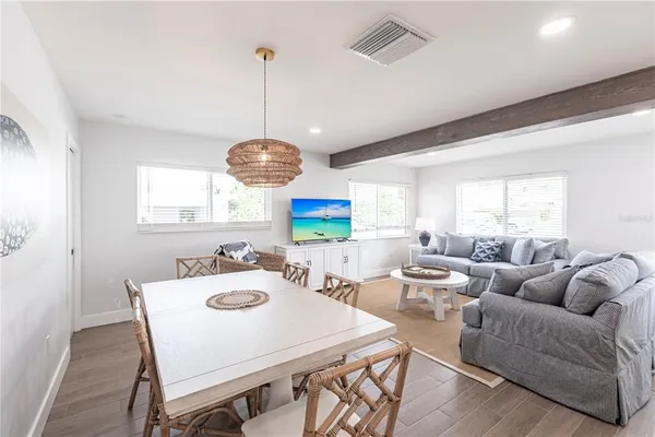 a very nice looking dining room with furniture and a window
