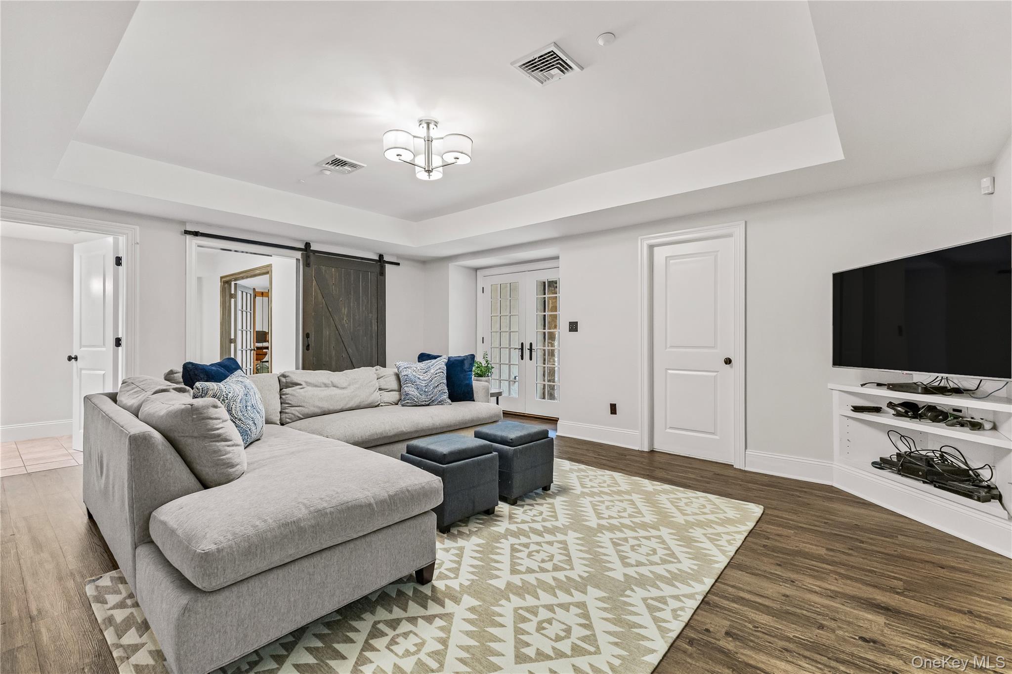 19 Park Drive South Rye, NY 10580 - Photo 37 of 42 a living room with furniture and a flat screen tv