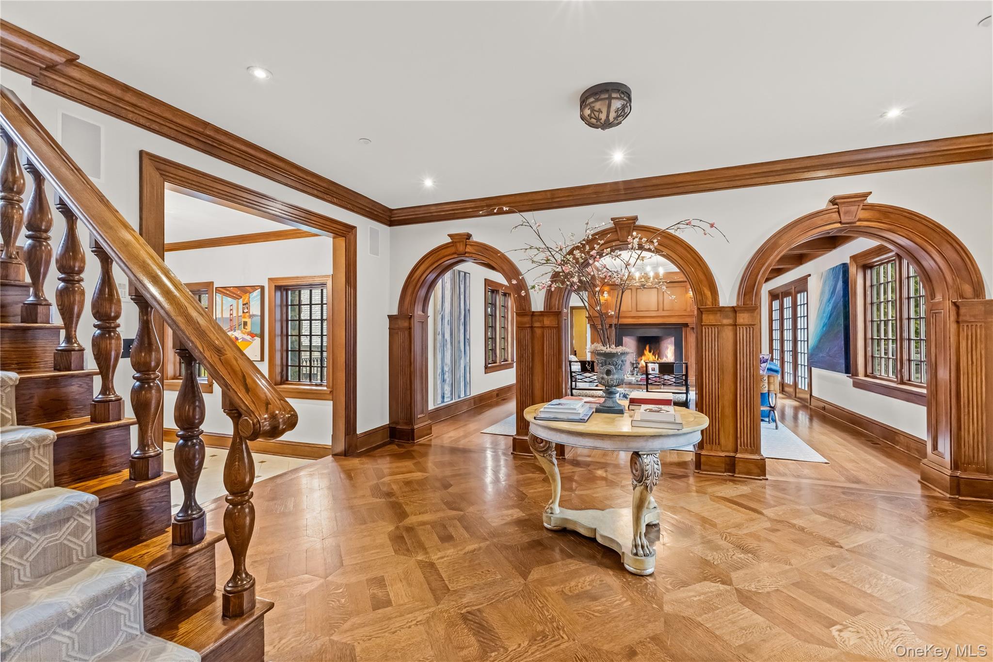 19 Park Drive South Rye, NY 10580 - Photo 8 of 42 a living room with couches a dining table and chairs with wooden floor