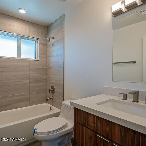 6227 North 13th Place, Unit 1 Phoenix, AZ 85014 - Photo 12 of 16 a bathroom with a sink toilet vanity and shower