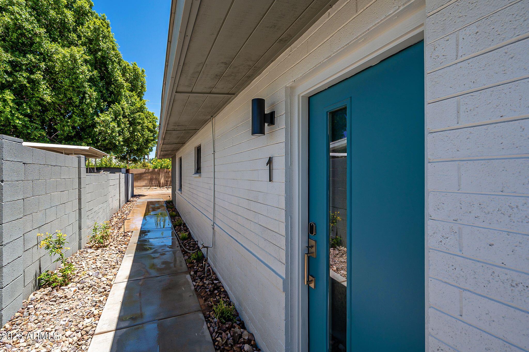 6227 North 13th Place, Unit 1 Phoenix, AZ 85014 - Photo 2 of 16 a view of a pathway with a house