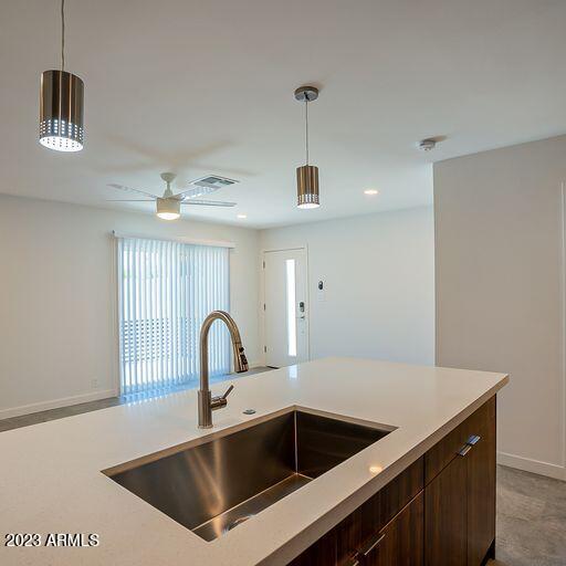 6227 North 13th Place, Unit 1 Phoenix, AZ 85014 - Photo 7 of 16 a kitchen with a sink and a refrigerator
