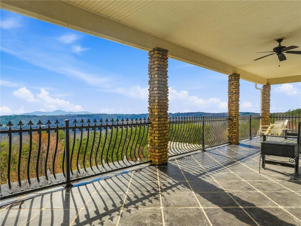 988 Hunters Ridge Jasper, GA 30143 - Photo 11 of 87 a view of a balcony with floor to ceiling windows with wooden floor