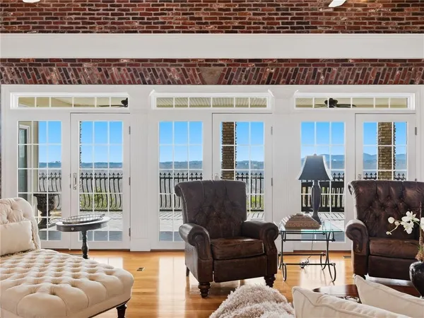 a kitchen with stainless steel appliances granite countertop a sink a stove and a microwave