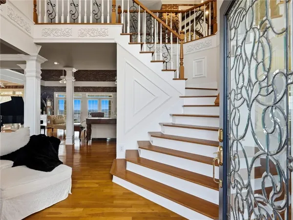 a kitchen with stainless steel appliances granite countertop a sink a stove and cabinets