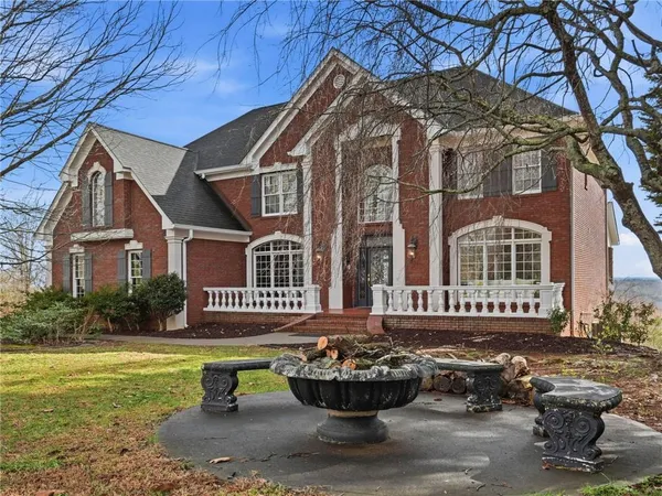 a front view of house with yard and green space