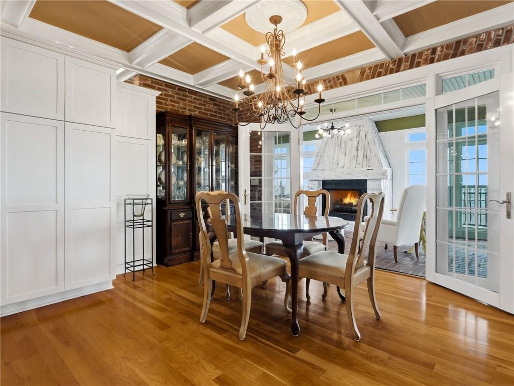 988 Hunters Ridge Jasper, GA 30143 - Photo 26 of 87 a dining room with furniture a chandelier and wooden floor
