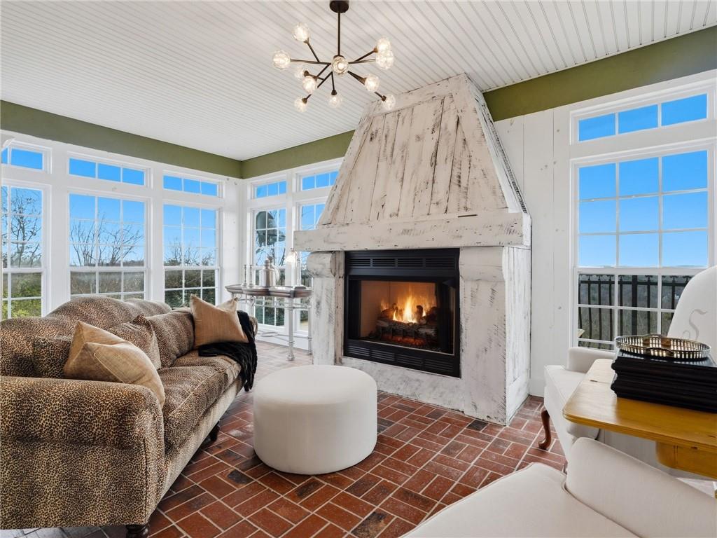 988 Hunters Ridge Jasper, GA 30143 - Photo 27 of 87 a living room with furniture a fireplace and a table