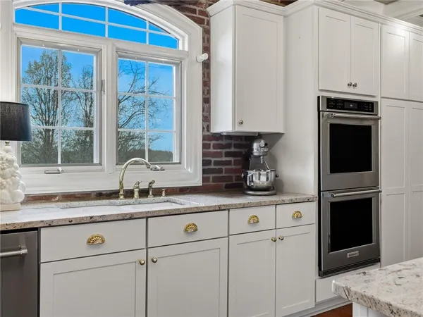 a bathroom with a shower and a sink