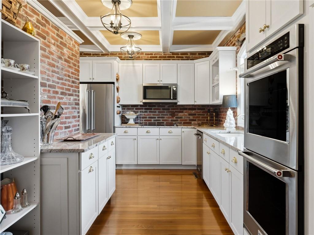 988 Hunters Ridge Jasper, GA 30143 - Photo 32 of 87 a kitchen with stainless steel appliances a stove refrigerator sink and cabinets