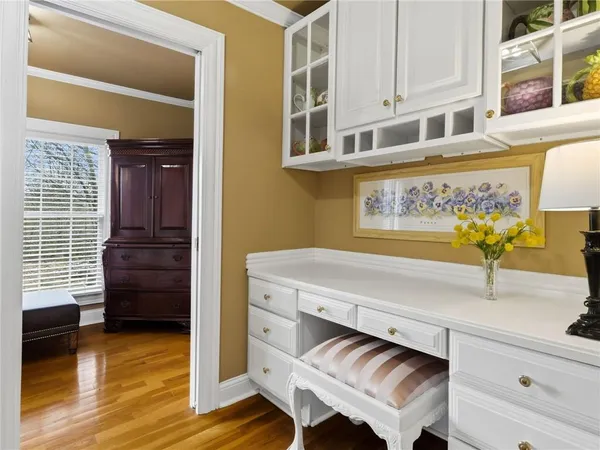 a view of a kitchen cabinets and wooden floor