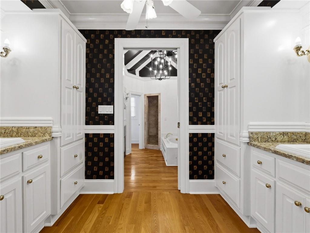 988 Hunters Ridge Jasper, GA 30143 - Photo 37 of 87 a spacious bathroom with a granite countertop sink and a mirror