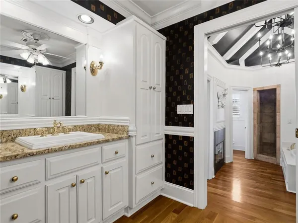 a bedroom with a bed and a chair