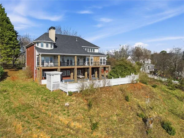 an aerial view of a house with a yard and potted plants