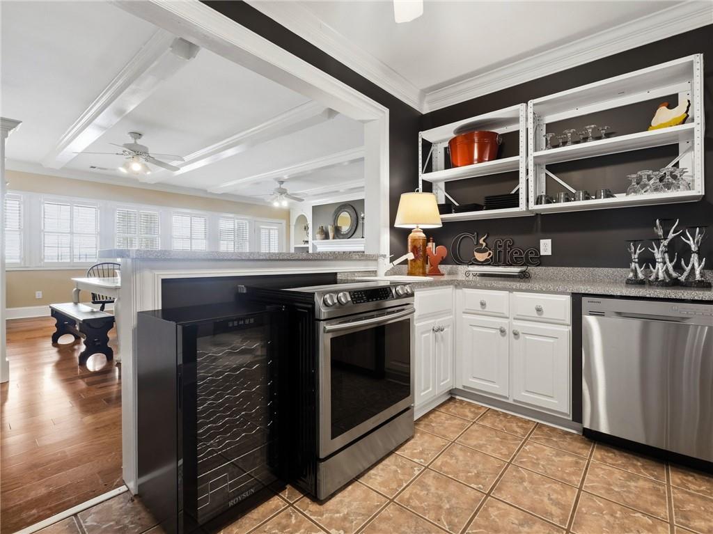 988 Hunters Ridge Jasper, GA 30143 - Photo 61 of 87 a kitchen with stainless steel appliances granite countertop a stove and a sink