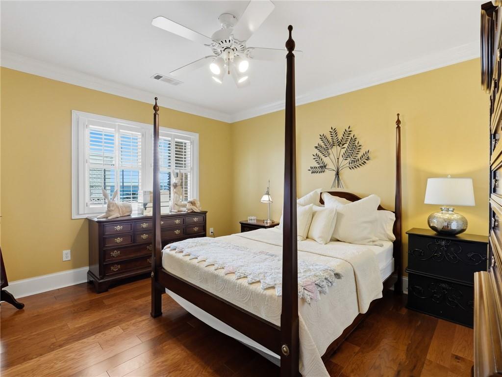 988 Hunters Ridge Jasper, GA 30143 - Photo 66 of 87 a bedroom with a bed and wooden floor