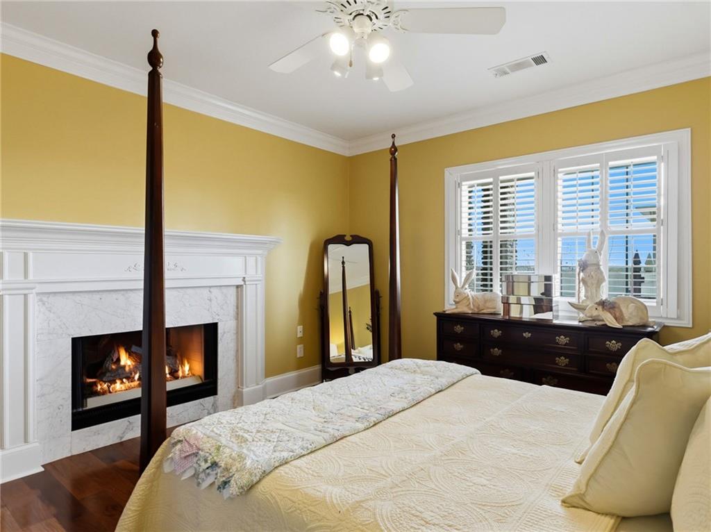 988 Hunters Ridge Jasper, GA 30143 - Photo 67 of 87 a bedroom with a bed and a fireplace