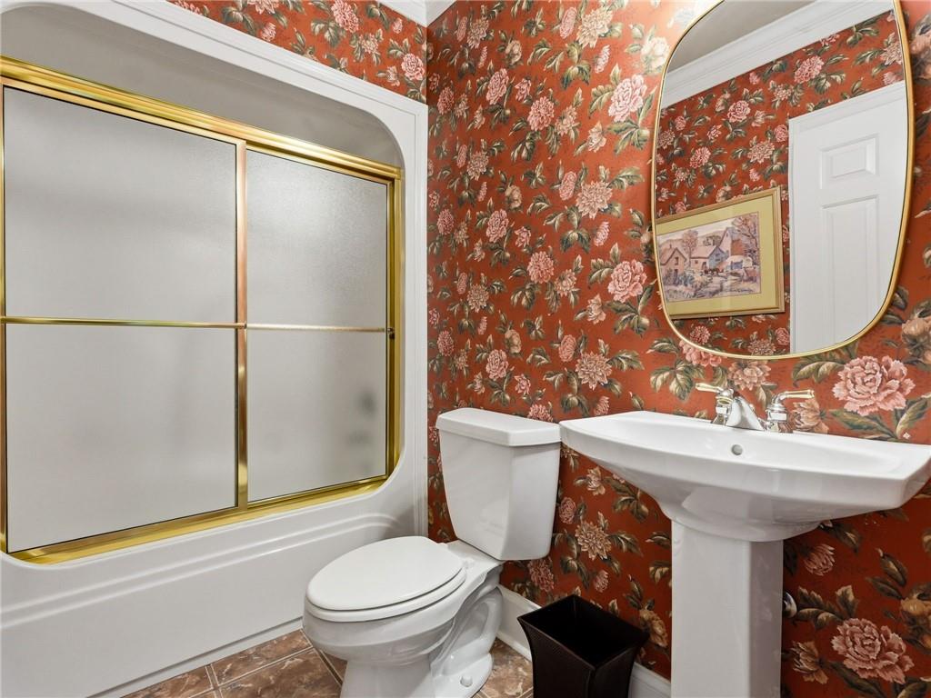 988 Hunters Ridge Jasper, GA 30143 - Photo 68 of 87 a bathroom with a sink mirror toilet and shower