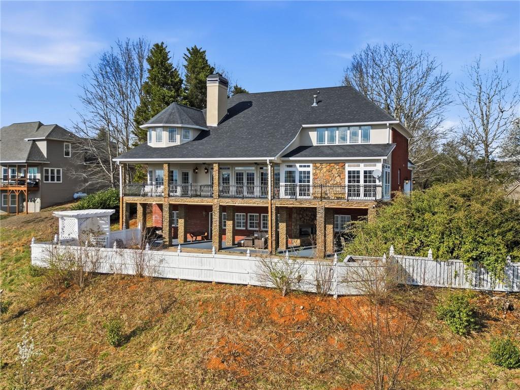 988 Hunters Ridge Jasper, GA 30143 - Photo 7 of 87 a front view of a building with a yard table and chairs