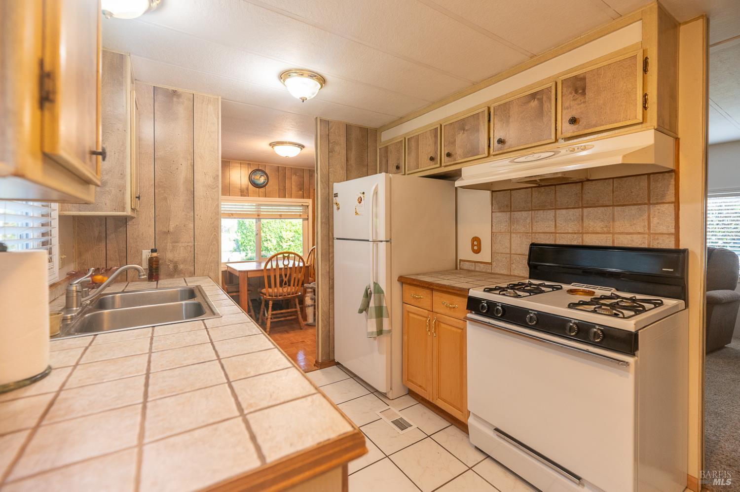 316 Círculo Durango Rohnert Park, CA 94928 - Photo 14 of 33 a kitchen with a stove a refrigerator and a cabinets
