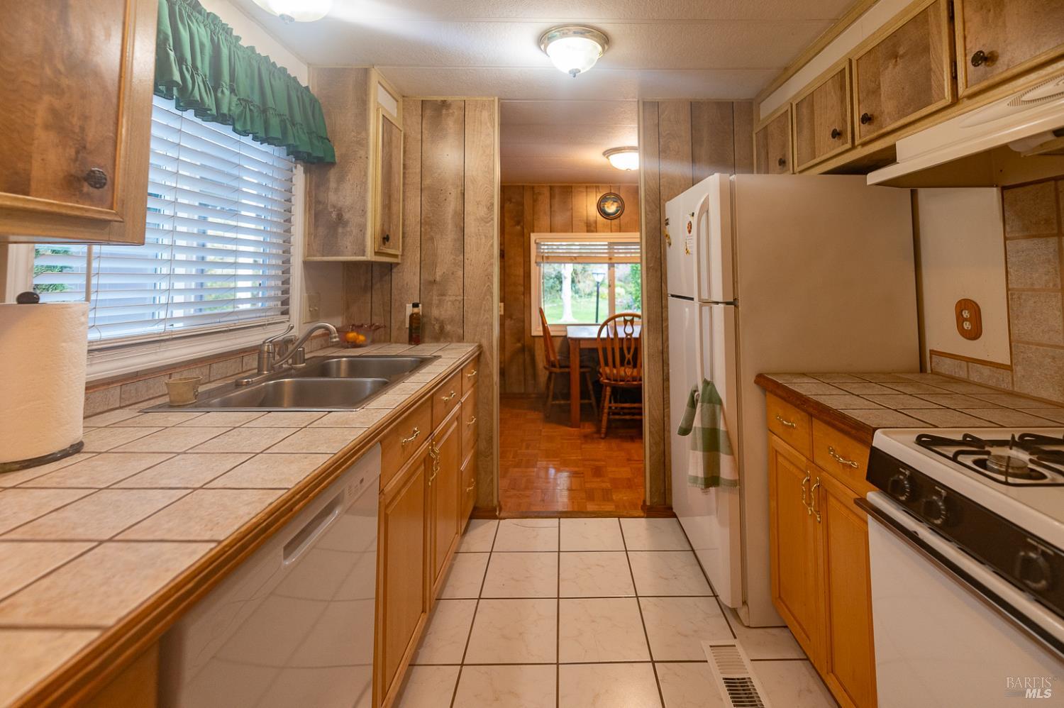 316 Círculo Durango Rohnert Park, CA 94928 - Photo 15 of 33 a kitchen with a sink a stove and a refrigerator