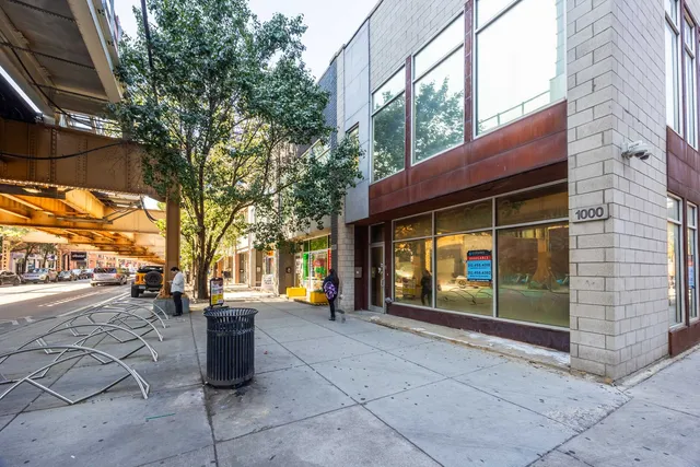 a view of outdoor space with a car parked in front of it