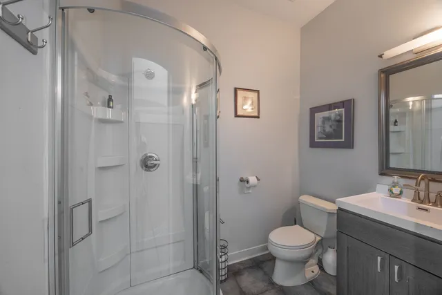 a bathroom with a toilet sink and shower