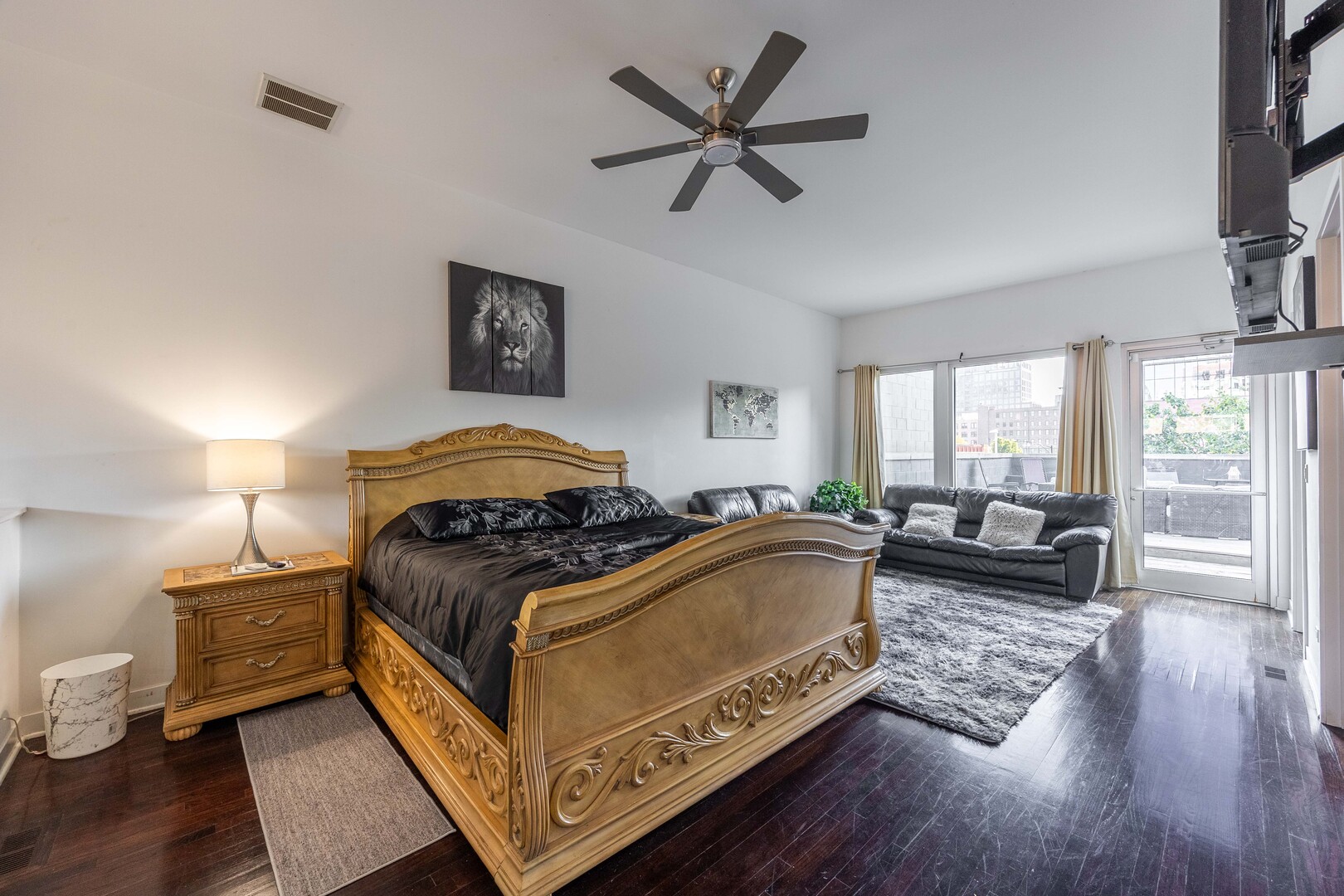 1002 West Lake Street, Unit 2 Chicago, IL 60607 - Photo 16 of 29 a bedroom with a bed and wooden floor