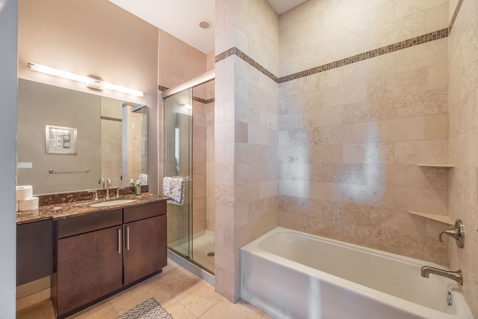 1002 West Lake Street, Unit 2 Chicago, IL 60607 - Photo 18 of 29 a bathroom with a tub sink and mirror