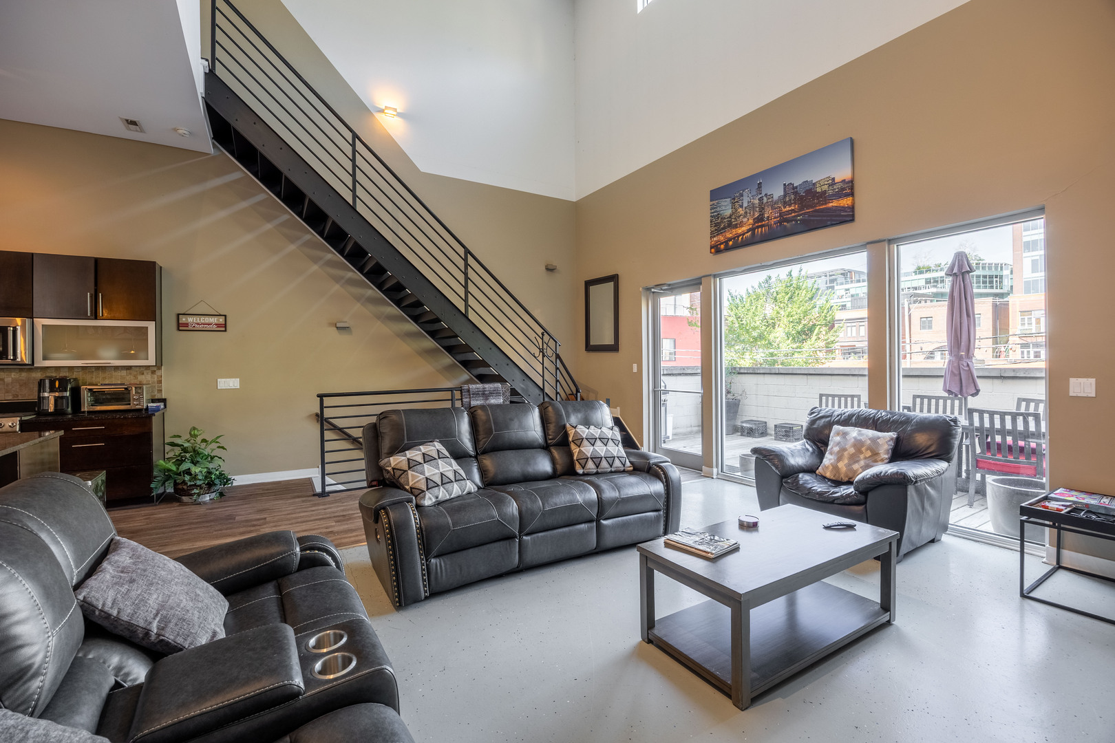 1002 West Lake Street, Unit 2 Chicago, IL 60607 - Photo 5 of 29 a living room with furniture and a large window