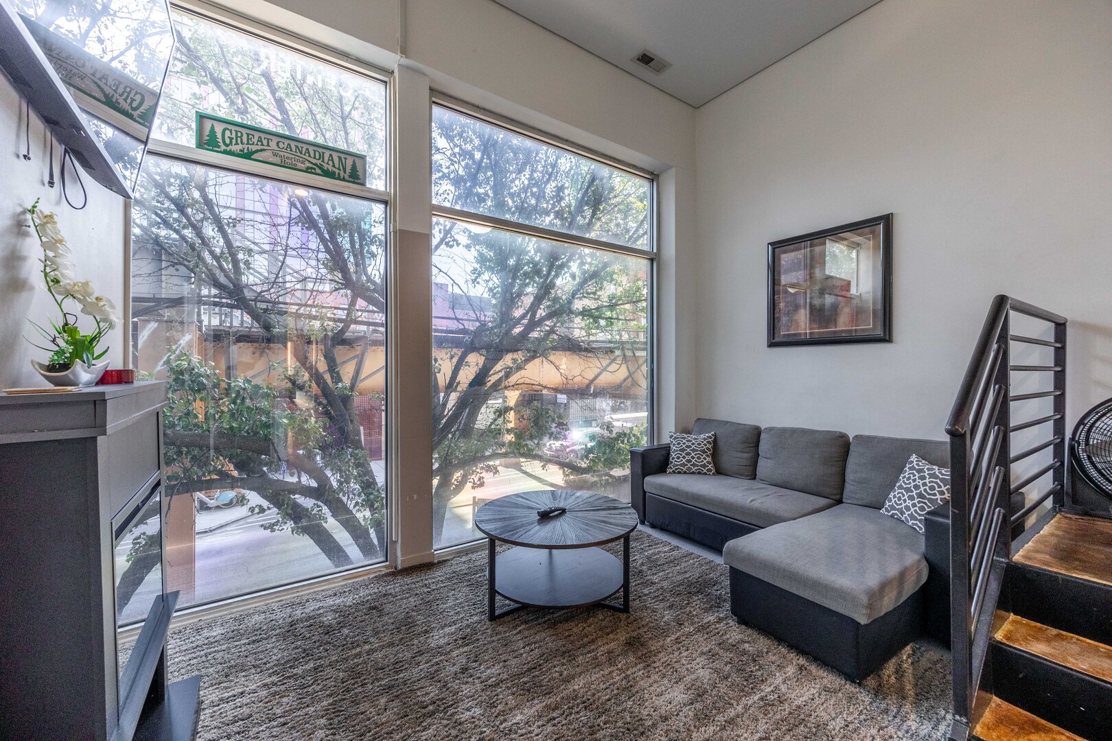 1002 West Lake Street, Unit 2 Chicago, IL 60607 - Photo 10 of 29 a living room with furniture and a large window