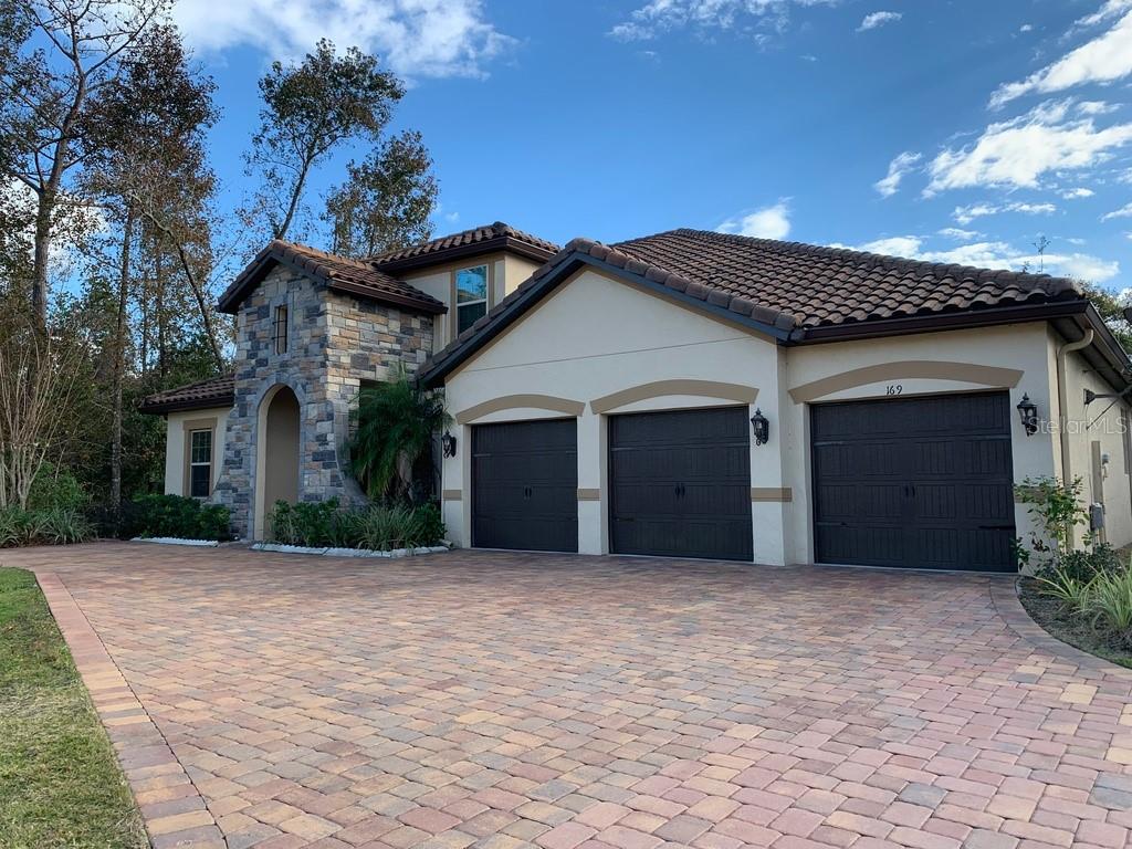 169 Adler Point Oviedo, FL 32765 - Photo 1 of 1 a front view of a house with a garden