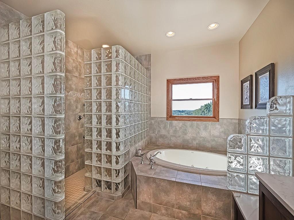 166 McKay Road Saxonburg, PA 16056 - Photo 29 of 48 a bathroom with a tub a sink and a shower