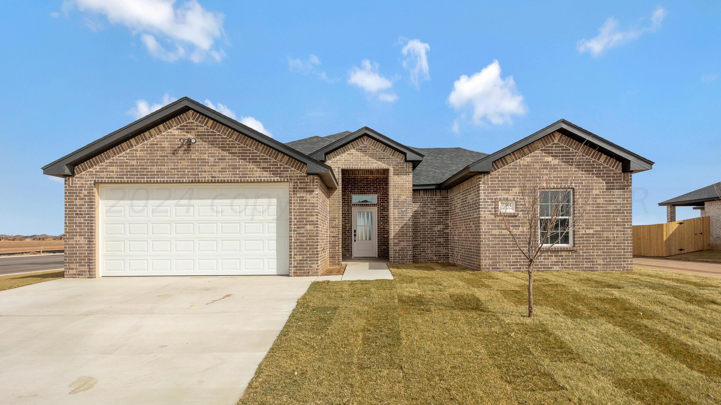 7501 John Thomas Street Amarillo, TX 79119 - Photo 1 of 30 a front view of a house with a yard