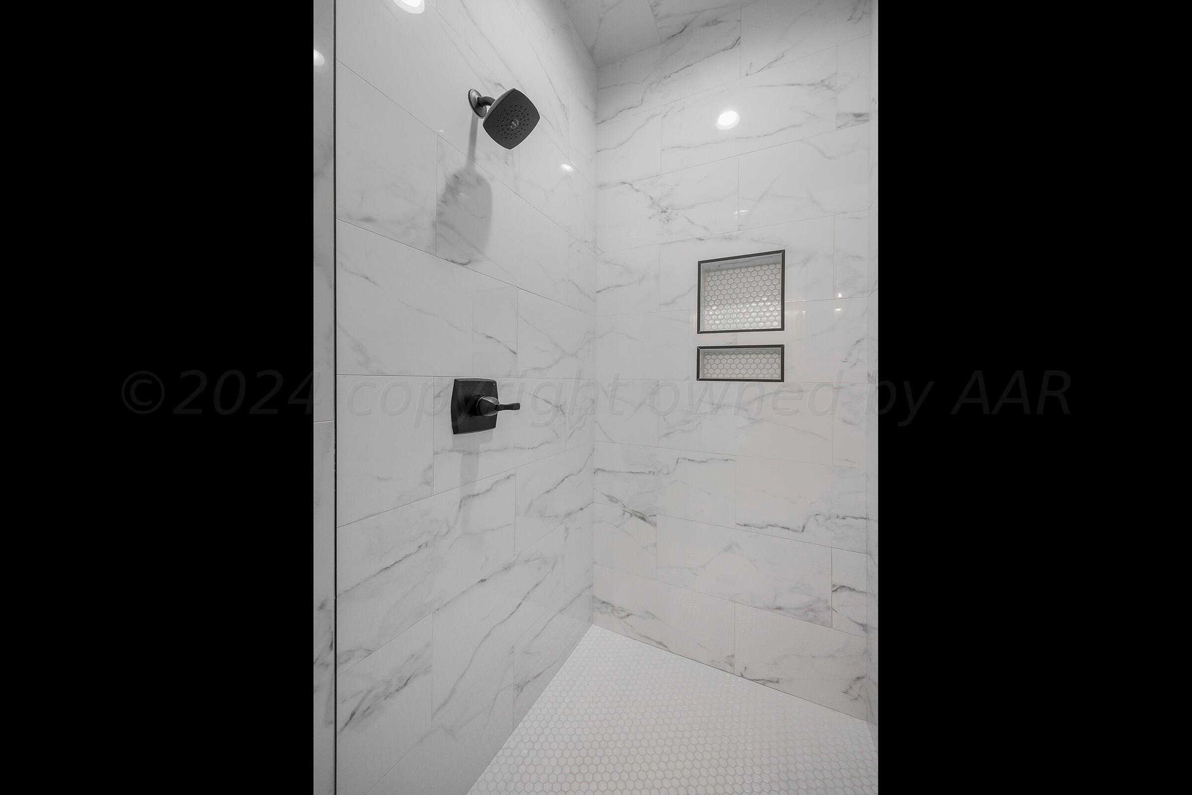 7501 John Thomas Street Amarillo, TX 79119 - Photo 19 of 30 a bathroom with a shower