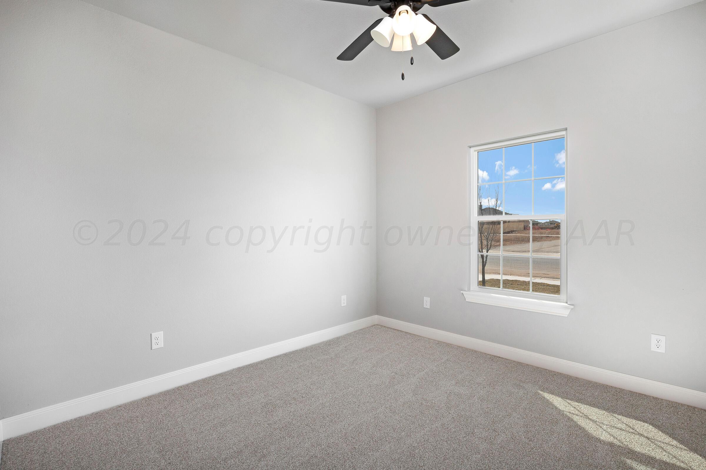 7501 John Thomas Street Amarillo, TX 79119 - Photo 25 of 30 a view of an empty room with a window