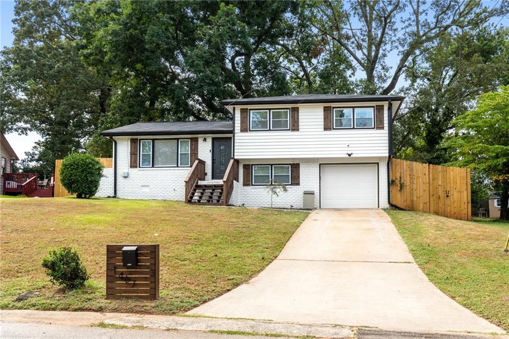 1467 Timms Circle Southeast Atlanta, GA 30316 - Photo 1 of 19 a front view of a house with glass top table and chairs