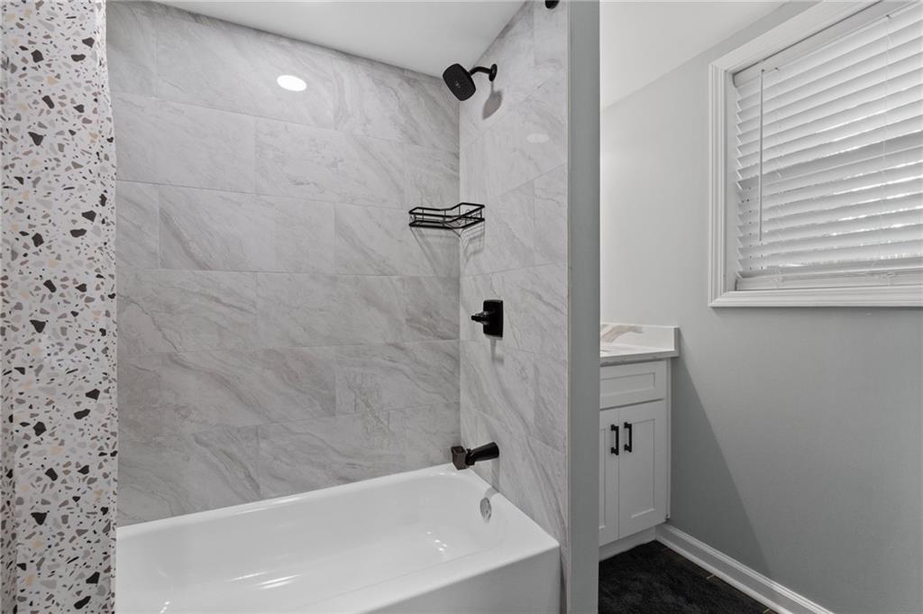 1467 Timms Circle Southeast Atlanta, GA 30316 - Photo 15 of 19 a bathroom with a bathtub and shower