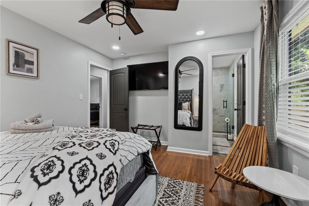 1467 Timms Circle Southeast Atlanta, GA 30316 - Photo 9 of 19 a spacious bedroom with a bed a couch and dresser