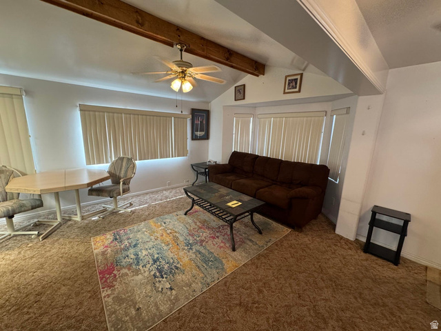 1225 North Dixie Downs Road, Unit 100 St. George, UT 84770 - Photo 6 of 22 Living area featuring vaulted ceilings with exposed wood beams
