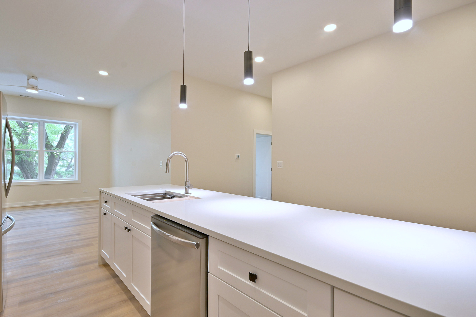 7518 Madison Street, Unit E Forest Park, IL 60130 - Photo 11 of 30 a view of a kitchen with a sink and wooden floor