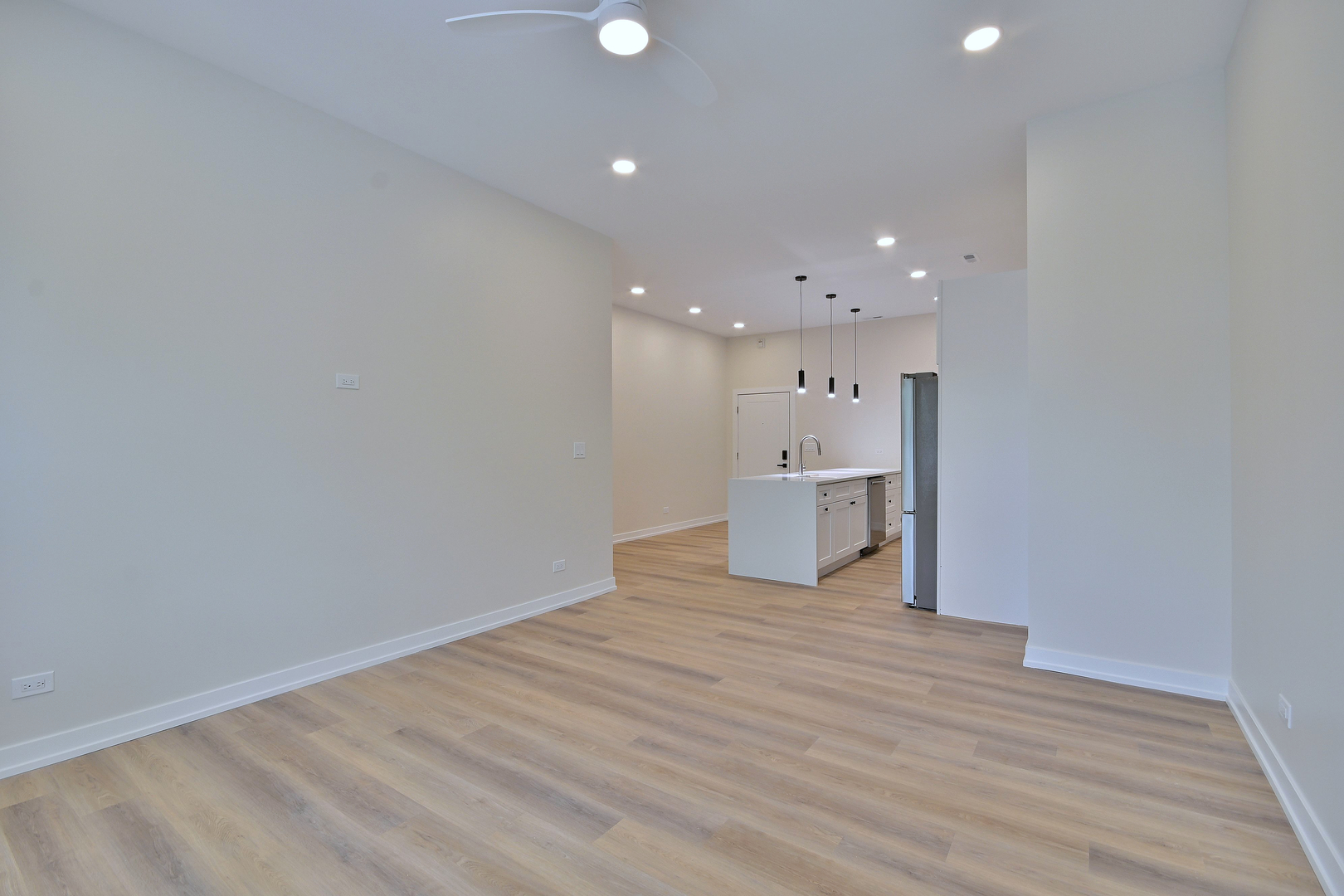 7518 Madison Street, Unit E Forest Park, IL 60130 - Photo 14 of 30 a view of a kitchen with a refrigerator and a sink